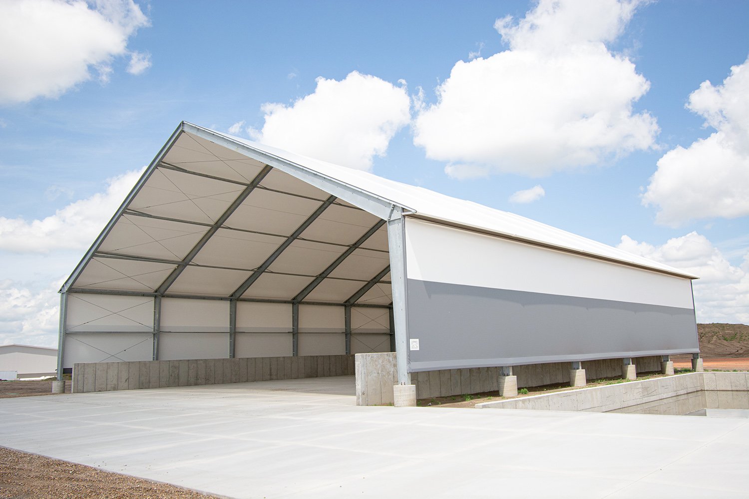 Custom municipal building design using hybrid steel and tension fabric for durability.