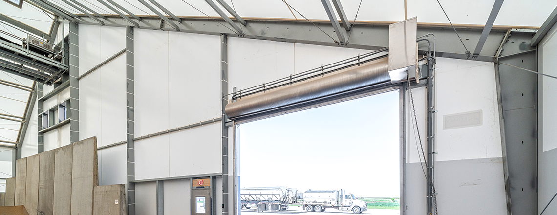 endwall with overhead door and conveyor opening