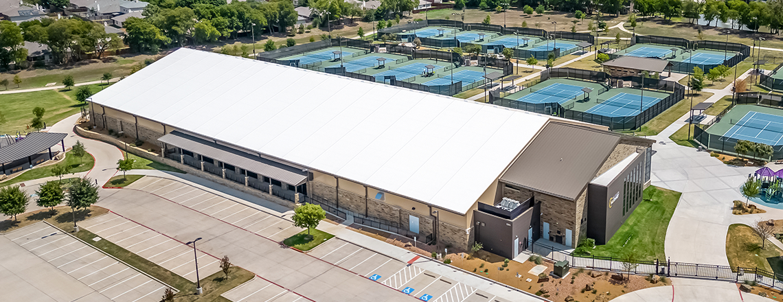 tension fabric sports building with stone exterior