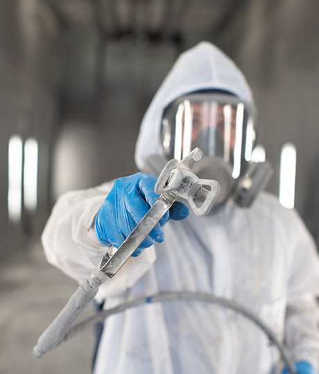 painter in epoxy paint booth