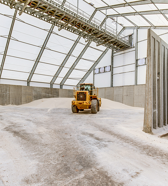 fabric structure with conveyor and precast walls