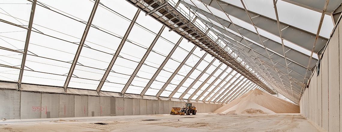 large bulk storage building with conveyor