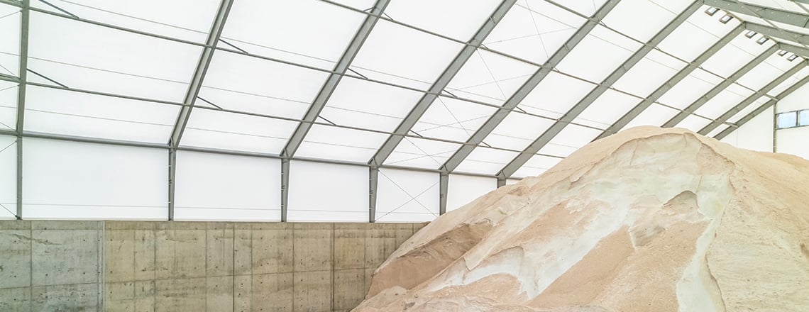 sidewall of fabric building with cast-in-place concrete