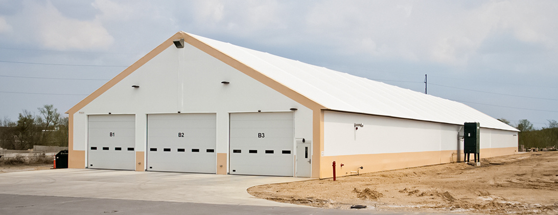 tension fabric vehicle storage building with three overhead doors