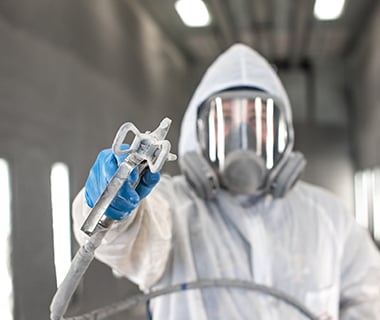 painter in Legacy paint booth