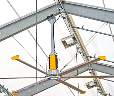 fan hanging in a tension fabric equine barn