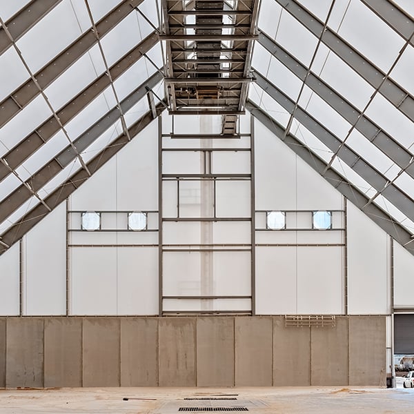 endwall of bulk storage building with conveyor