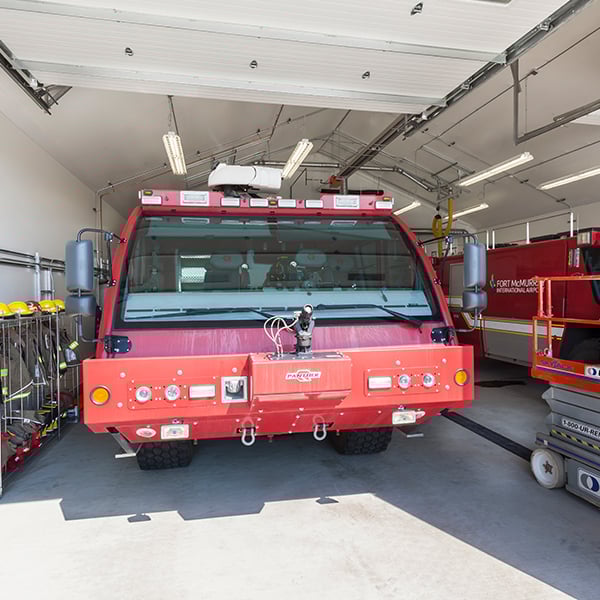 fire trucks inside tension fabric building
