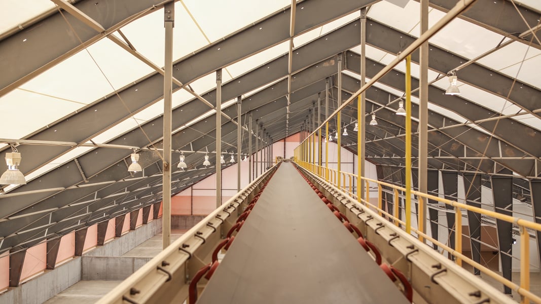 conveyor of tension fabric frac sand storage building