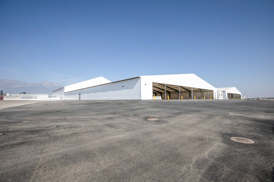 two mirrored fabric cargo logistics facilities